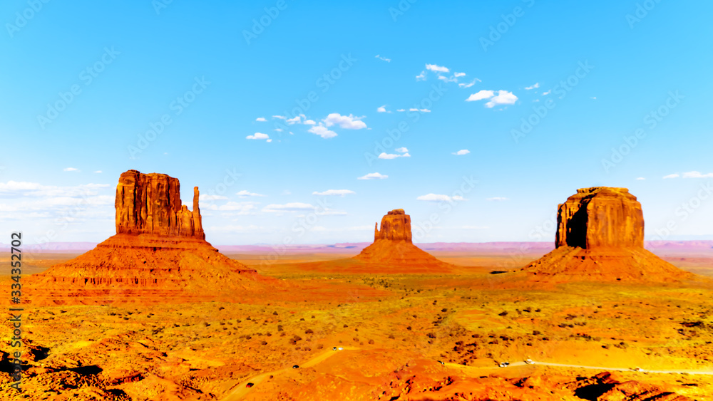 The sandstone formations of East and West Mitten Buttes and Merrick Butte in Monument Valley Navajo Tribal Park in southern Utah, United States