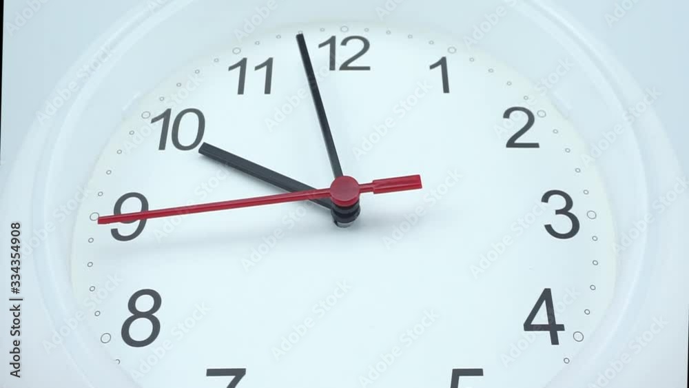 White wall clock face beginning of time 09.57 am or pm. on white background, Time concept. White wall clock face beginning of time 09.57 am or pm. on white background, Time concept.
