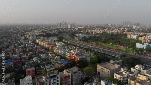 Skyscrappers of Kolkata patuli biswabangla highland park bypass cityscape drone footage aerial view. Indian high way roads and landmarks of subcontinent forward push photo