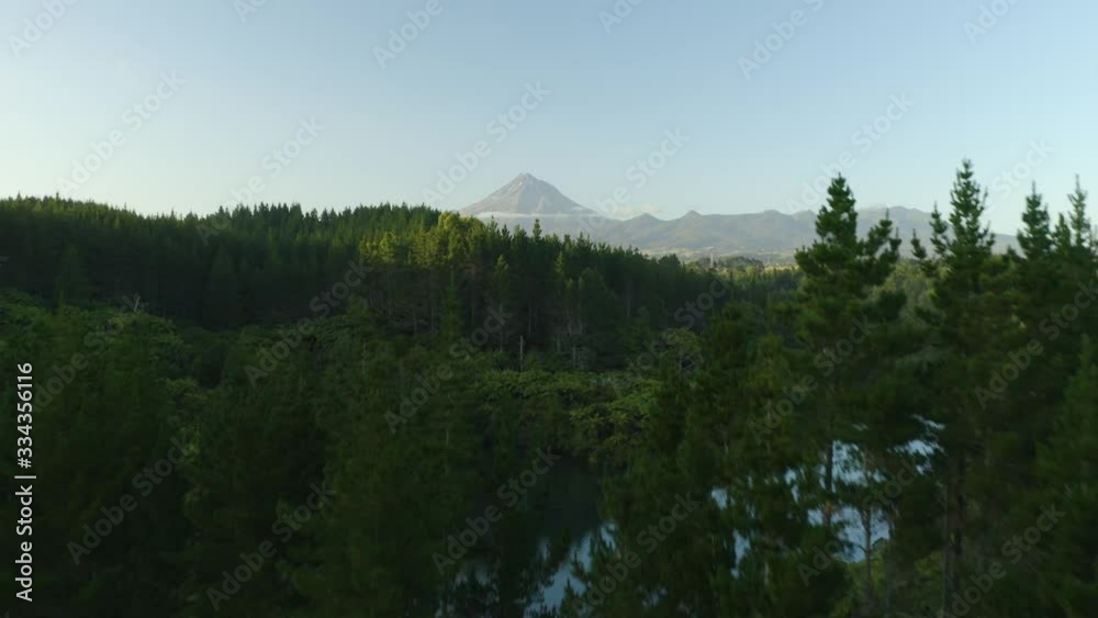 Aerial reveal of Mount Taranaki in beautiful New Zealand forest wilderness Aerial reveal of Mount Taranaki in beautiful New Zealand forest wilderness