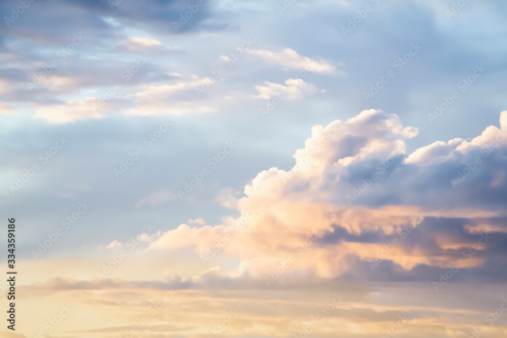 Isolated View of Multi-Colored Clouds Against Pale Blue Sky at Sunset