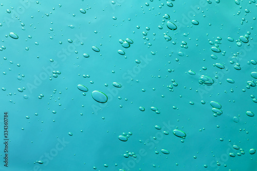 Air bubbles close up on a blue background