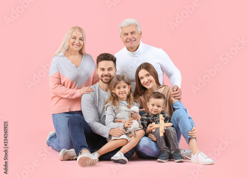 Portrait of big family on color background © Pixel-Shot