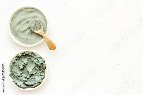 Blue cosmetic clay on white background top-down copy space