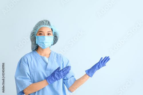 Asian doctor showing someth...