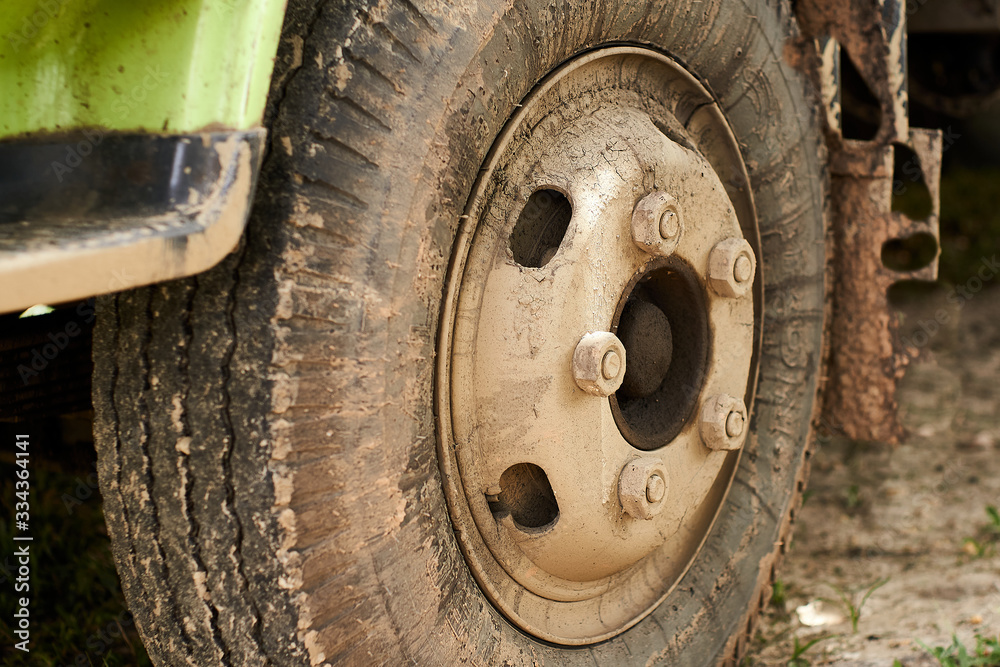 closeup of Dirty truck tire on the parking area closeup of Dirty truck tire on the parking area