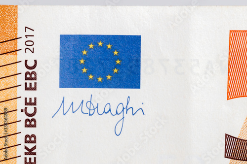 Pruszcz Gdanski, Poland - March 29, 2020: Europe union flag and Mario Draghi's signature on 50 Euro banknote. Mario Draghi is president of the European Central Bank. photo