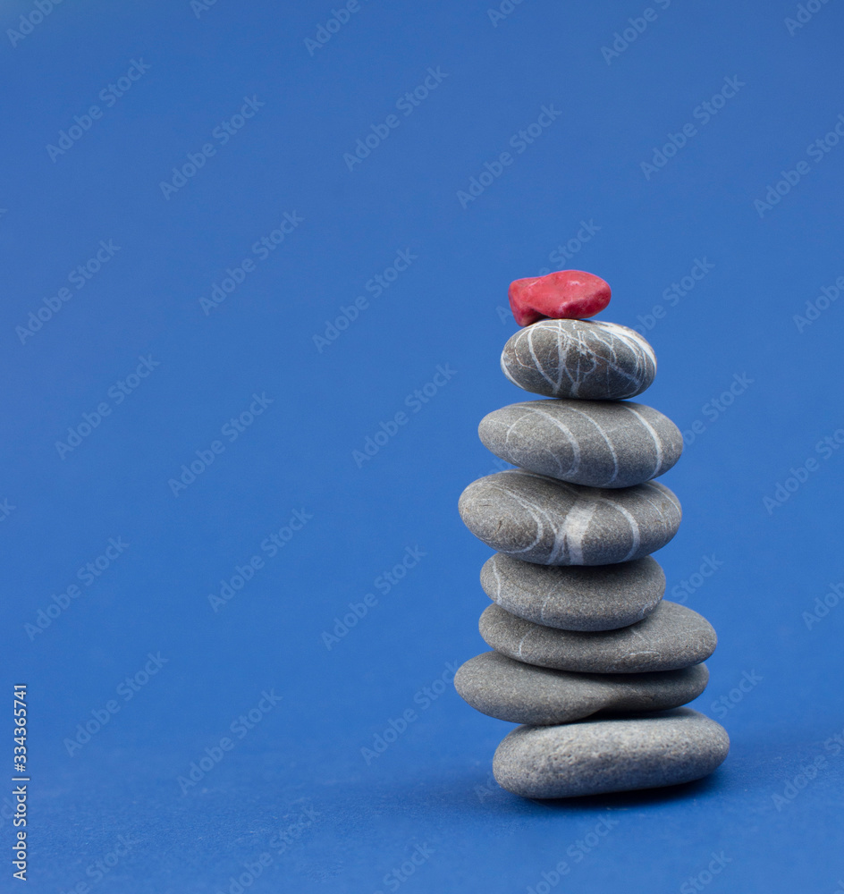 Stack of stones on wooden table, space for text. Zen concept Stack of stones on wooden table, space for text. Zen concept