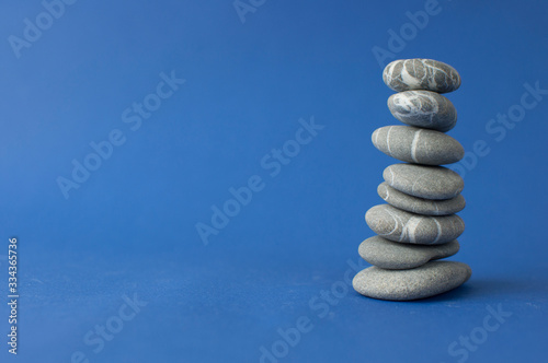Stack of stones on wooden table  space for text. Zen concept