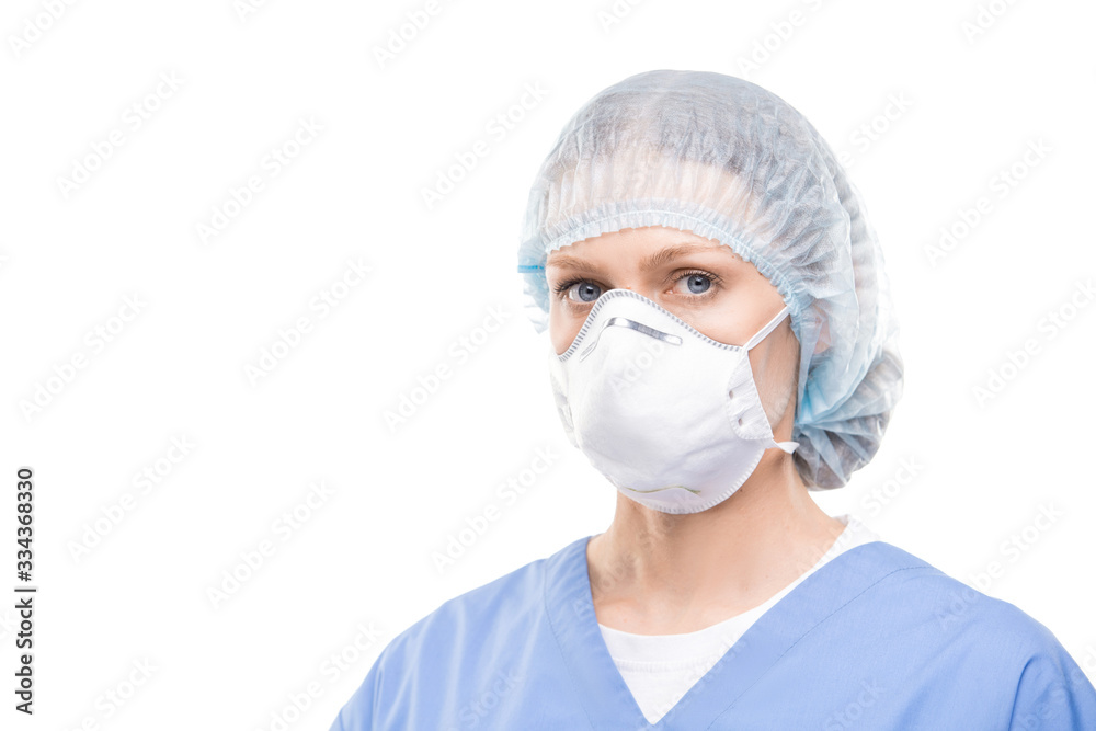 Contemporary young female doctor or nurse in protective mask and uniform Contemporary young female doctor or nurse in protective mask and uniform