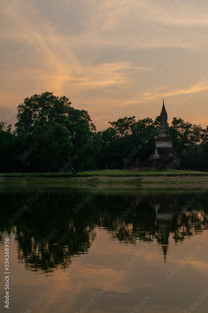 sunset temple over lake