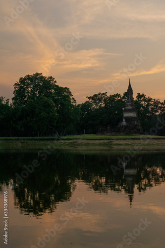 sunset temple over lake