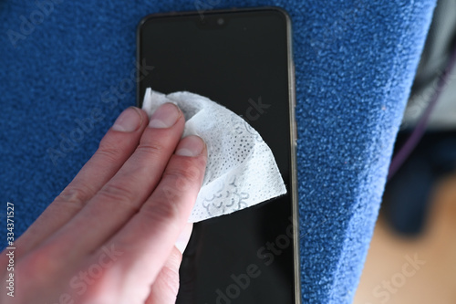 Precautions regarding coronavirus, cell phone disinfection. Cronavirus outbreak and flu covid ncov epidemic. Clean home concept photo