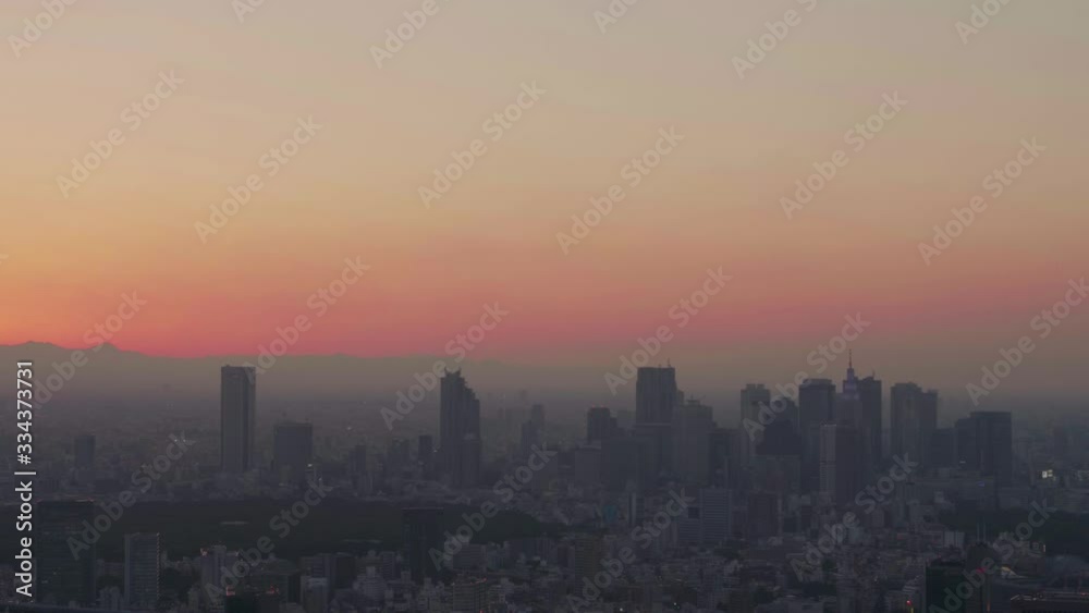dark silhouette of the Skyline of Tokyo, Japan while sunrise dark silhouette of the Skyline of Tokyo, Japan while sunrise