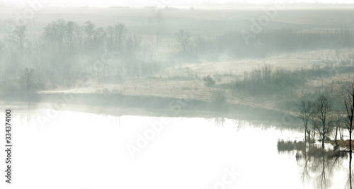 lake in the fog in the early morning