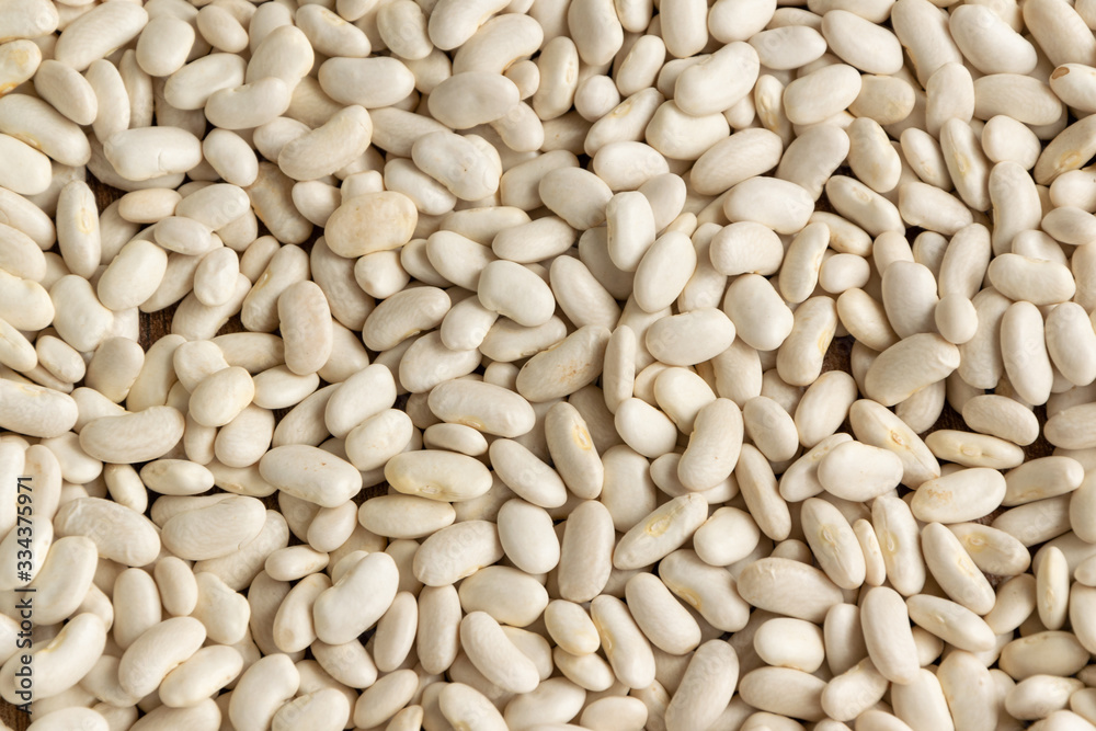 White raw aw beans background. Natural protein legume food White raw aw beans background. Natural protein legume food