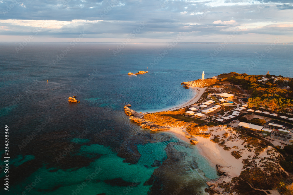 Aerial drone shot of Rottnest Island at sunrise. The Basin and Pinky beach can be seen below. 