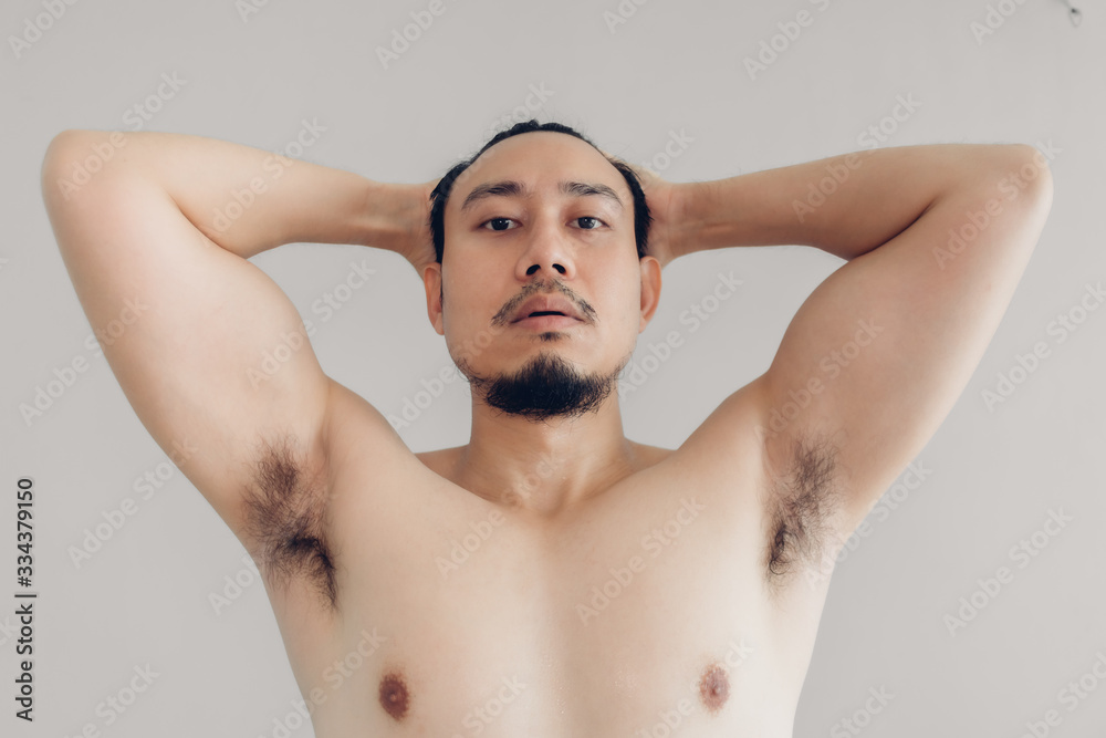 Topless Asian man is trying to be handsome. Topless Asian man is trying to be handsome.