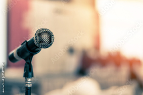 Microphone voice speaker in business seminar, speech presentation, town hall meeting, lecture hall or conference room in corporate or community event for host or townhall public hearing photo