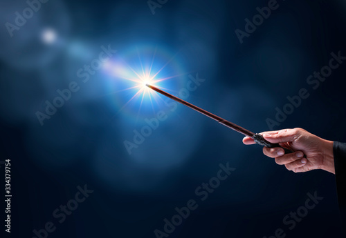 Fototapeta Magic wand with sparkle on miracle background, Miracle magical stick Wizard tool on hot background