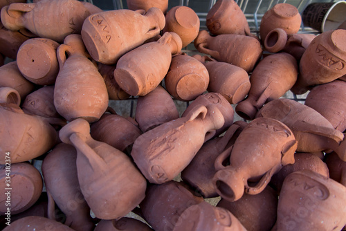 Slika na platnu small clay pots, souvenirs from Cana Galilee in Israel,