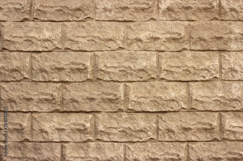 Old grey brick wall with plaster, background, texture