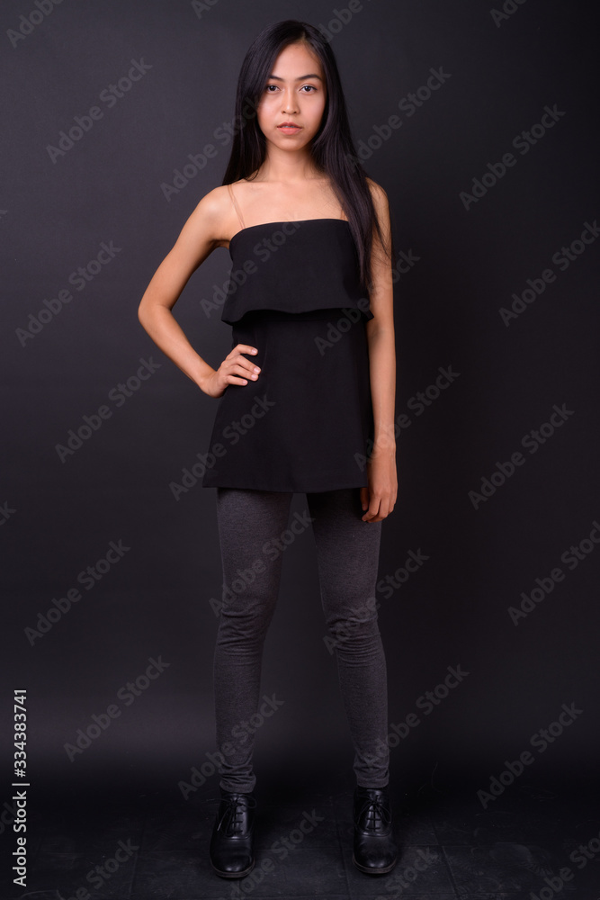 Full body shot of young beautiful Asian woman Full body shot of young beautiful Asian woman