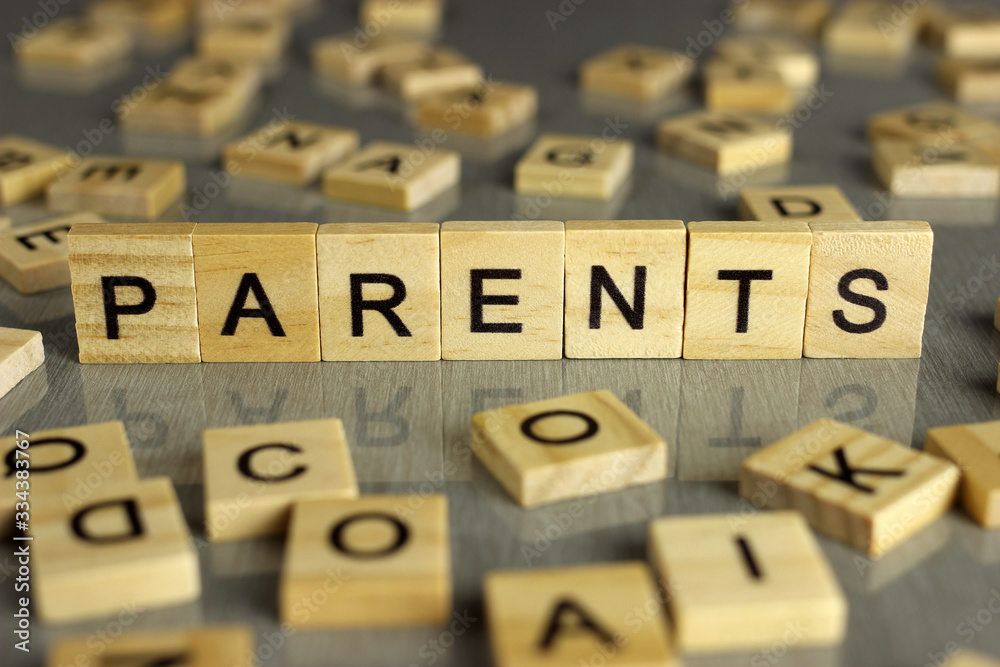 word parents is made of square wooden letters on a gray background word parents is made of square wooden letters on a gray background