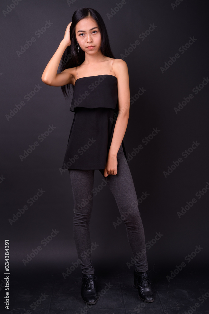 Full body shot of young beautiful Asian woman Full body shot of young beautiful Asian woman