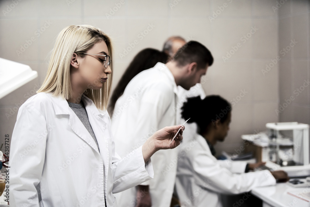 Laboratory scientist working at lab with test tube Laboratory scientist working at lab with test tube