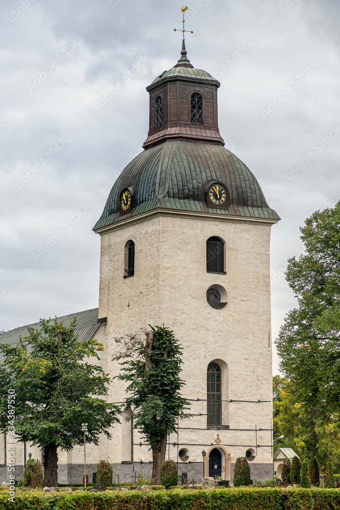 Old white stone church on the Swedish countryside