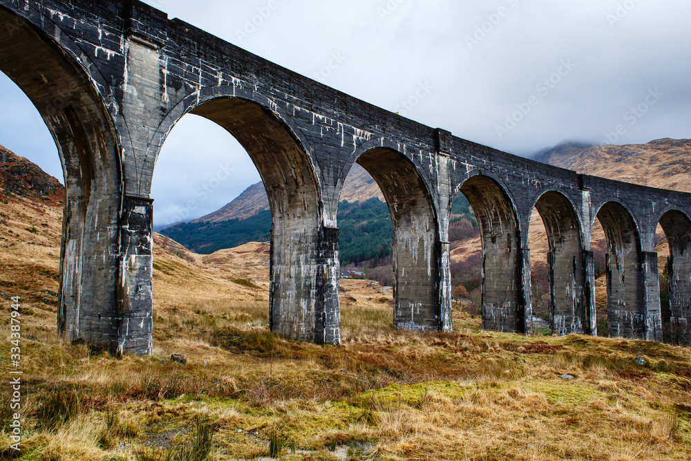 Arches of Glenfinnan train viaduct in a scottish autumn