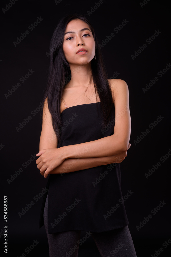Portrait of young beautiful Asian woman with arms crossed Portrait of young beautiful Asian woman with arms crossed