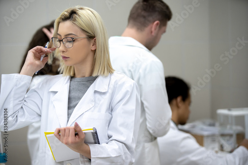 Laboratory scientist working at lab with test tube