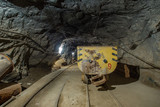 Mining ore cart wagon in underground gold mine tunnel