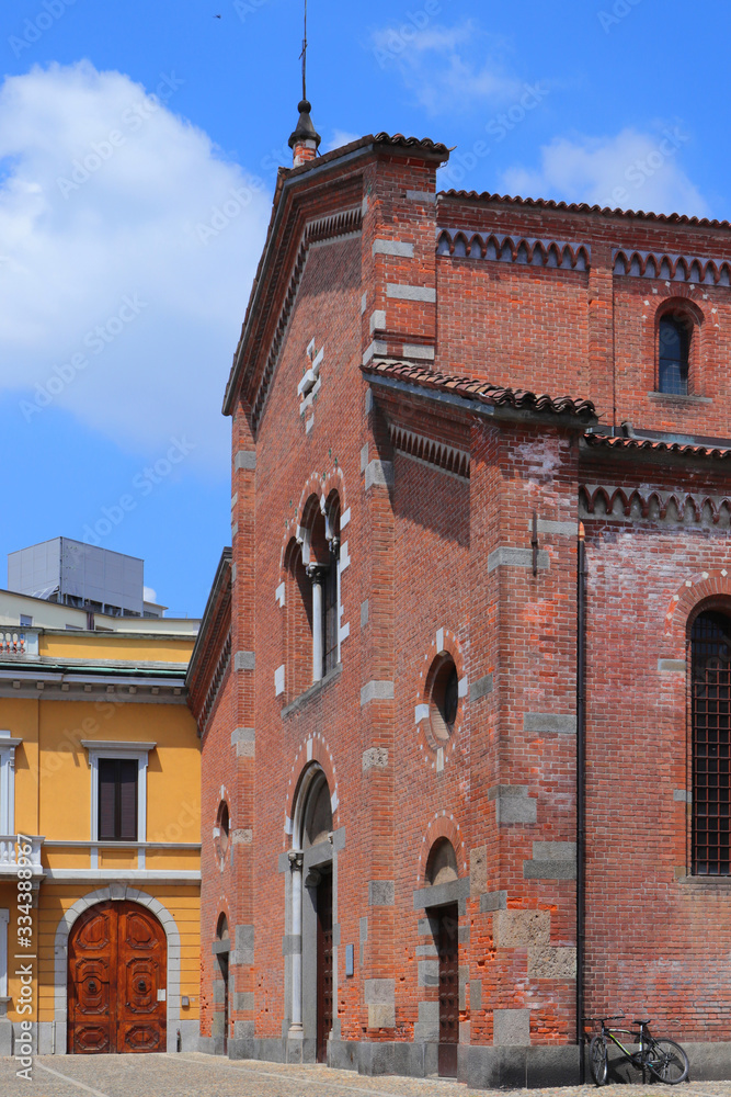 old red brick wall church in mona city in italy 