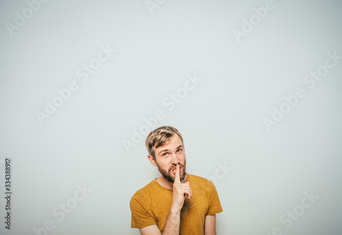 Canvas Print man put finger on her lips