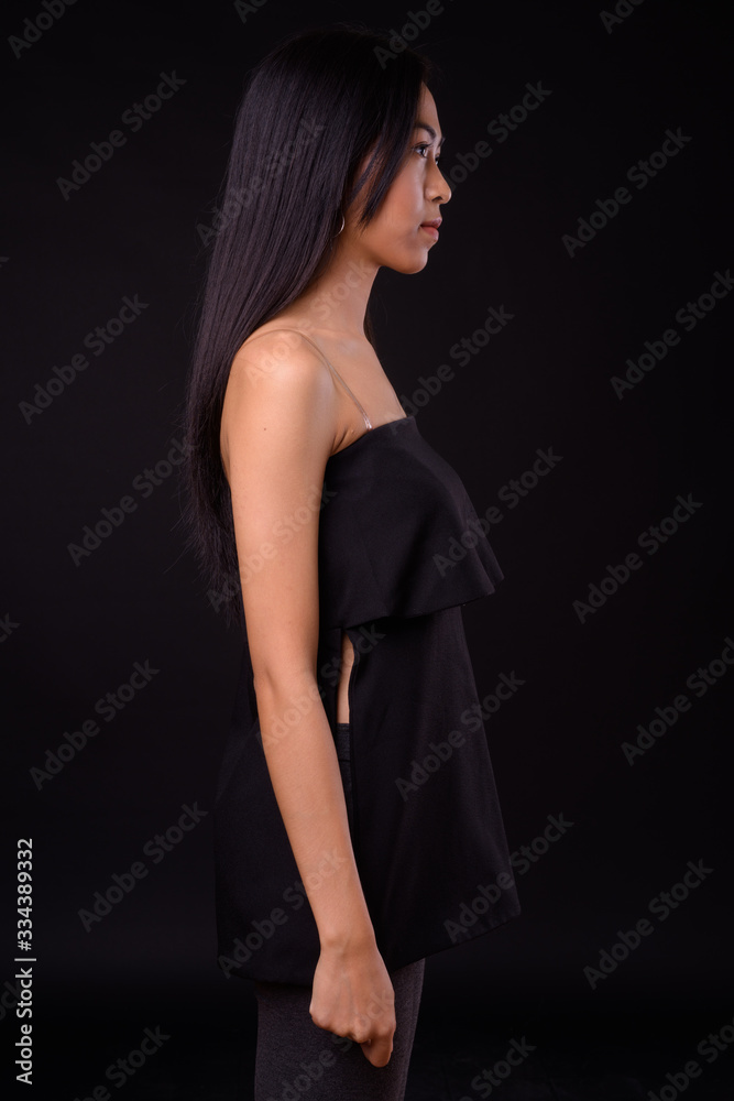 Profile view of young beautiful Asian woman