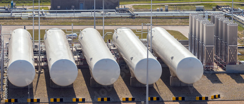 Aerial view of large liquefied natural gas storage tanks.