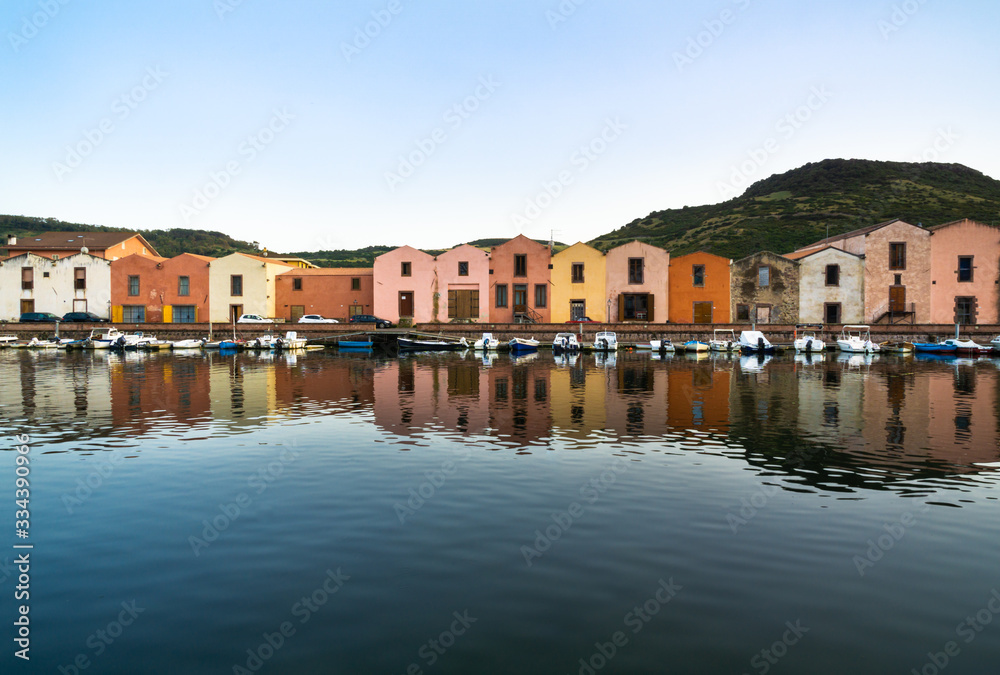 The Colorful Old buildings of Bosa reflected on the Temo River, Sardinia