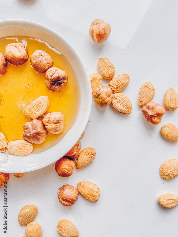 dried fruits and nuts in bowl on white background