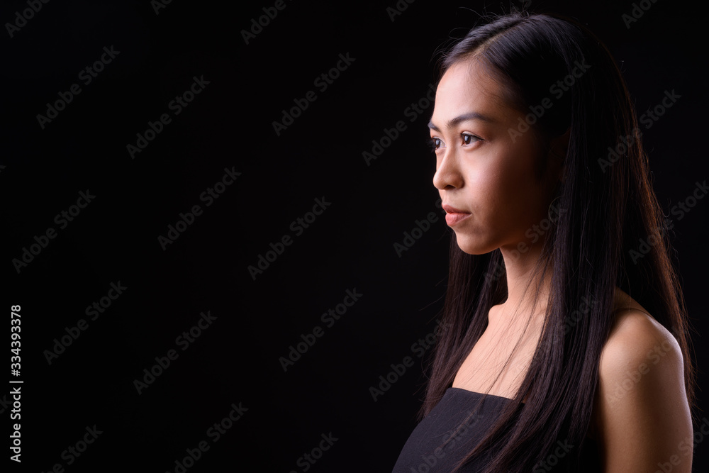 Fototapeta premium Closeup profile view of young beautiful Asian woman