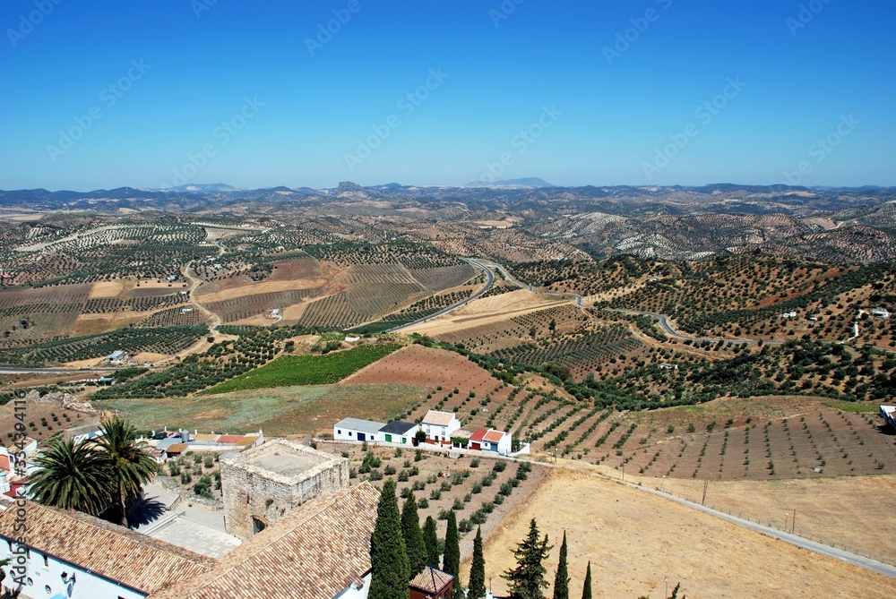 Elevated view of houses on the edge of town and surrounding countryside, Olvera, Spain.