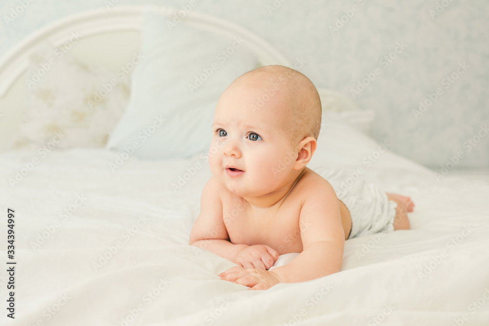 Naked baby on a light background. Naked baby on a light background.