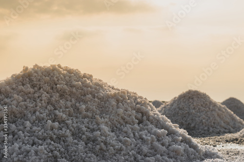 Sea salt piles in evaporation pond in Thailand photo