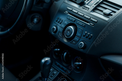Modern car interior selective focus. Soft colored toned image. Best for wallpapers. © Inception