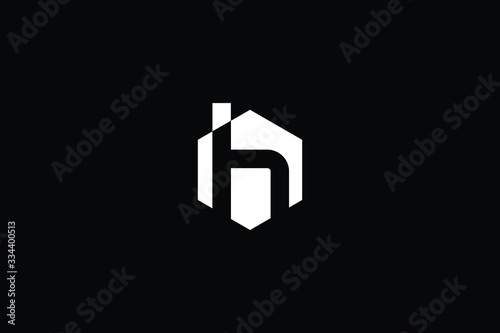 Logo design of H in vector for construction  home  real estate  building  property. Minimal awesome trendy professional logo design template on black background.