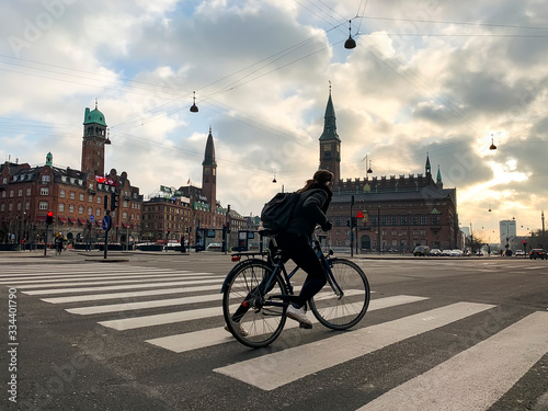 Sunrise over City Hall Square in Copenhagen, Denmark. February 2020 Cyclist on the square.