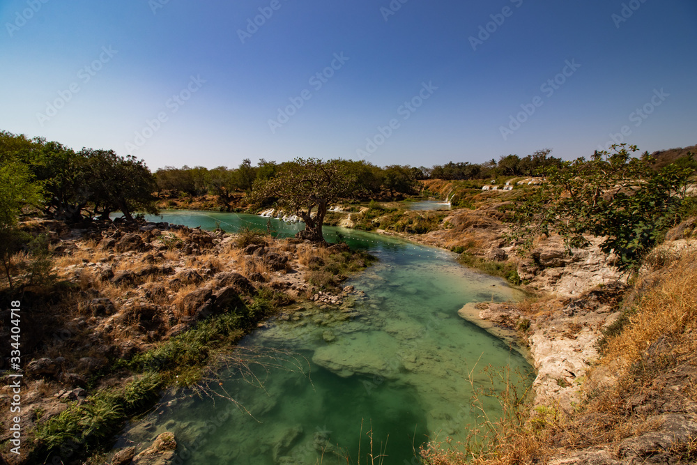 River Waterfall and pond in Wadi Darbat near Salalah River Waterfall and pond in Wadi Darbat near Salalah