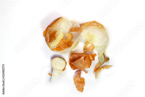 Food waste onion on a white background. Isolate. Top view. Flat lay. Waste for recycling. Responsible disposal of household food wastage in an environmentally friendly way by recycling.